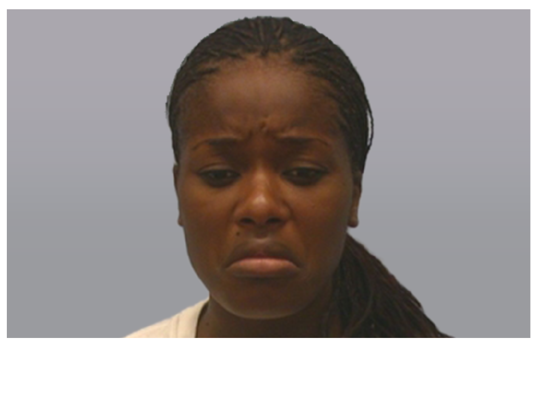 Portrait of a woman. Skin pushes in the middle of her forehead. Her eyebrows pull in and partly up and her eyes display a downward gaze. Her bottom lip is pulled down.